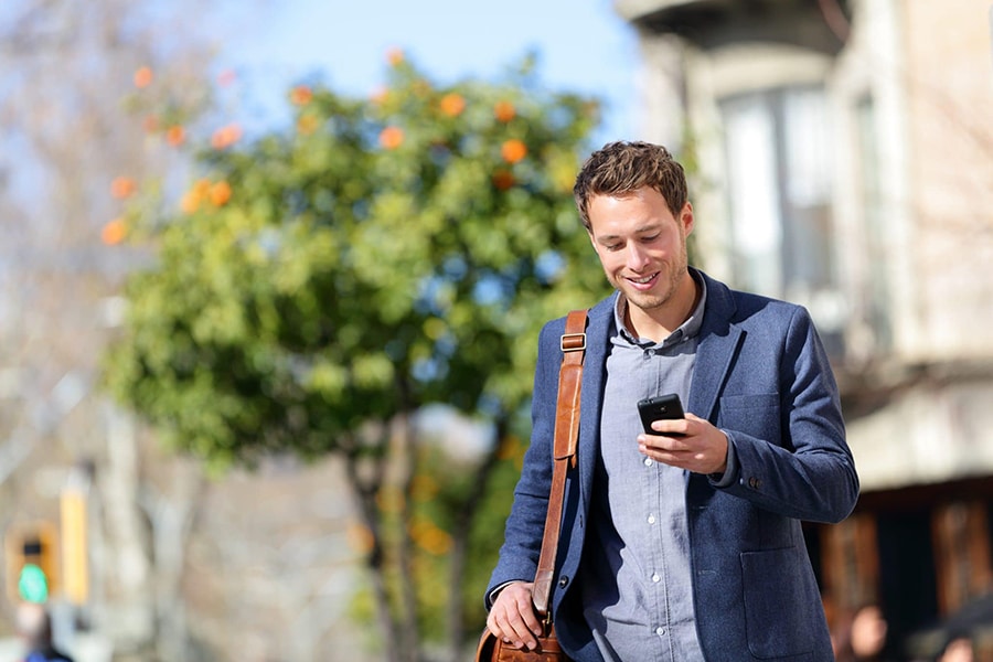 Man searches for a lawyer on his cell phone