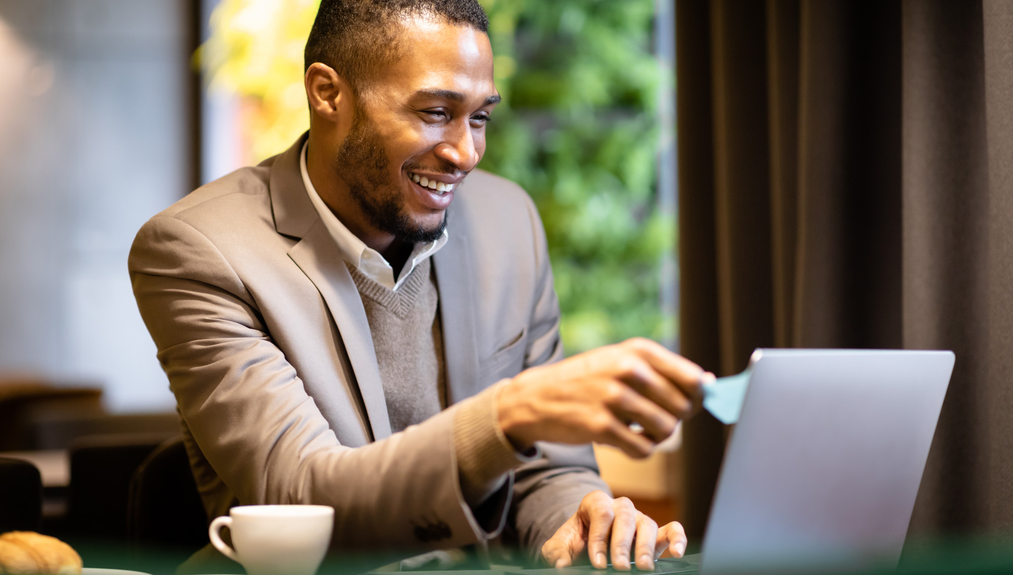 Man reading a law firm blog on his laptop