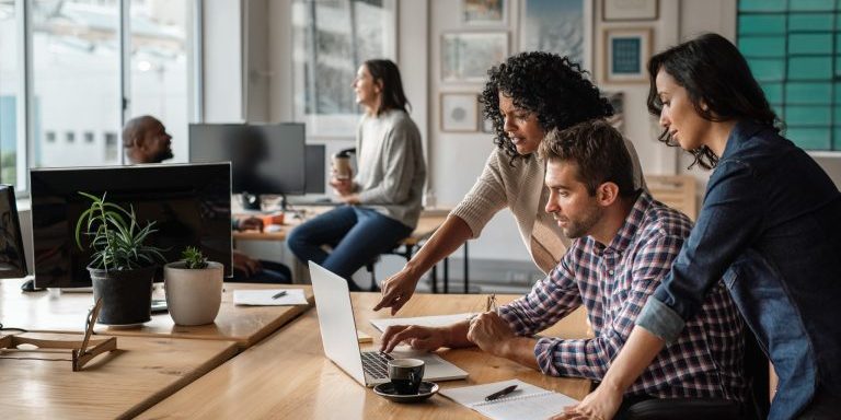 Marketing team collaborating on website content
